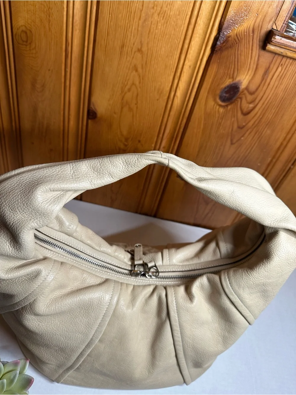 Cream Leather Shoulder Hobo Bag with Embossed Crest